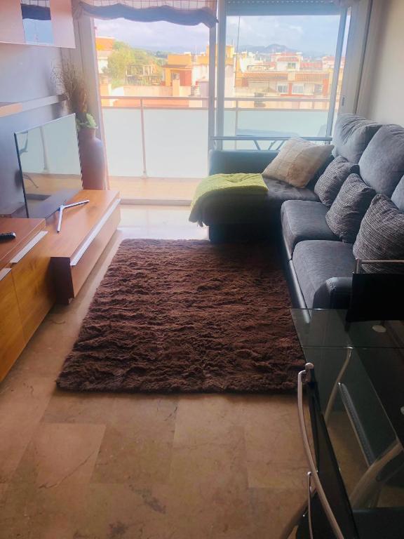 Posedenie v ubytovaní Apartamento con terraza y piscina en Malgrat de Mar