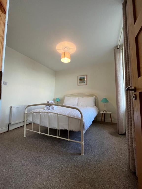 a bedroom with a bed in a room at Old Irish farmhouse in Dingle