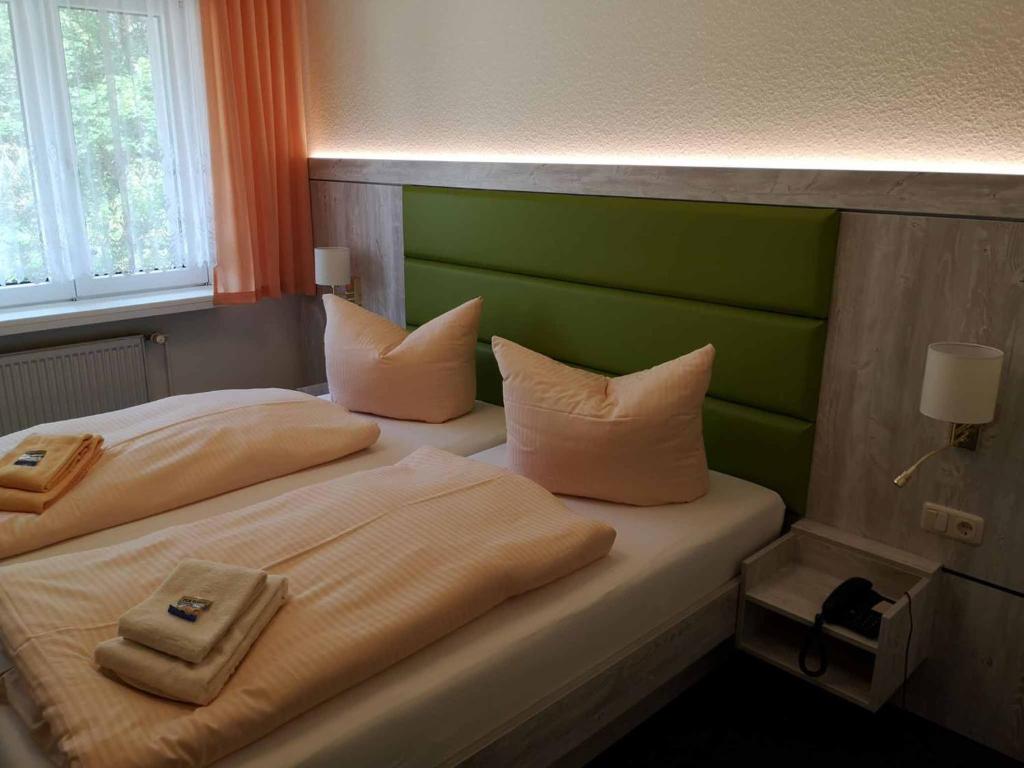 Postel nebo postele na pokoji v ubytování Gästehaus Tanne des DGD e.V.