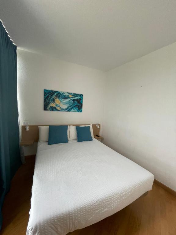 Postel nebo postele na pokoji v ubytování Hotel New Folías