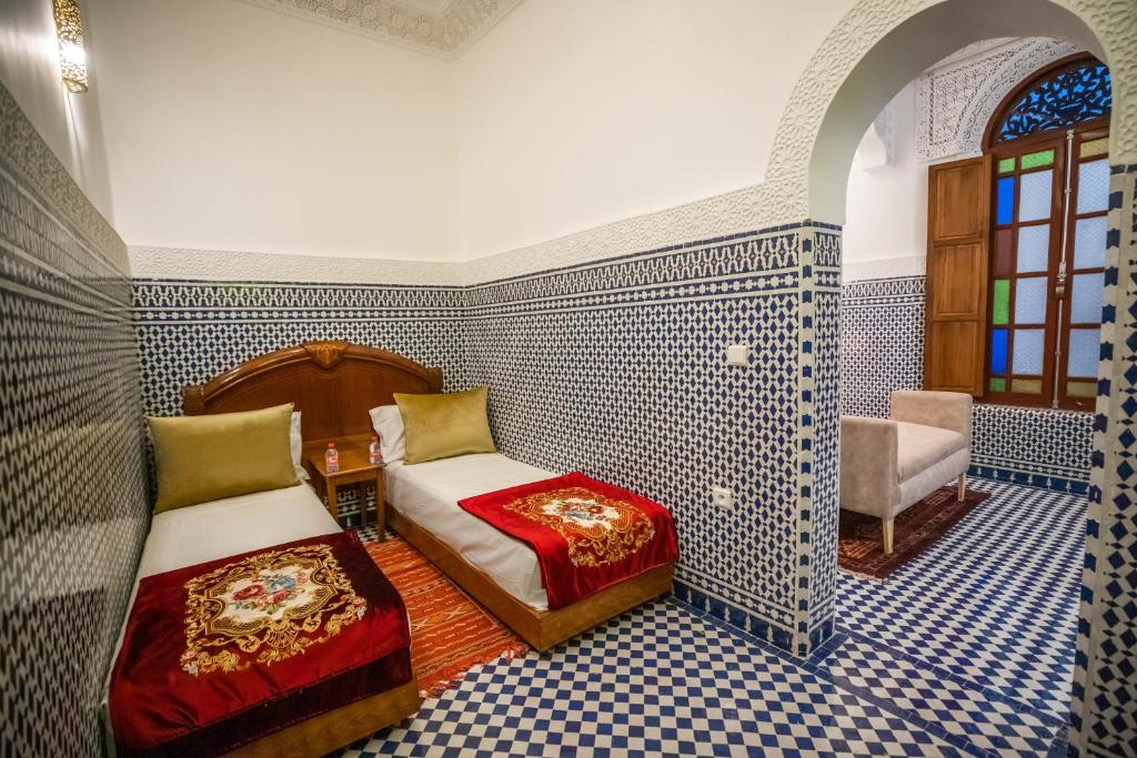 Postel nebo postele na pokoji v ubytování Riad Dilar Fes & Spa