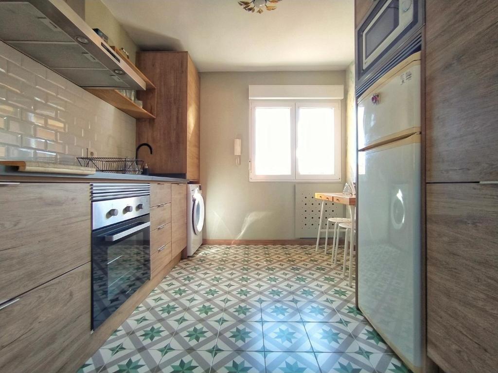 Kuchyň nebo kuchyňský kout v ubytování Una Ventana al Naranco