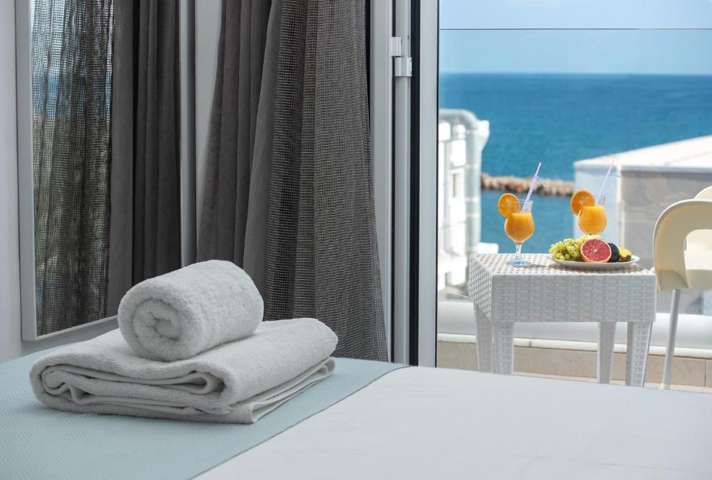 Posteľ alebo postele v izbe v ubytovaní Coral Hotel