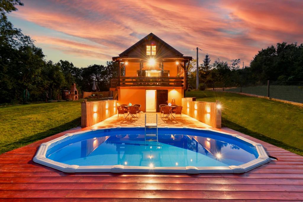 a house with a swimming pool on top of a roof at Jungle House with private pool and hot tub in Sveti Ivan Zelina