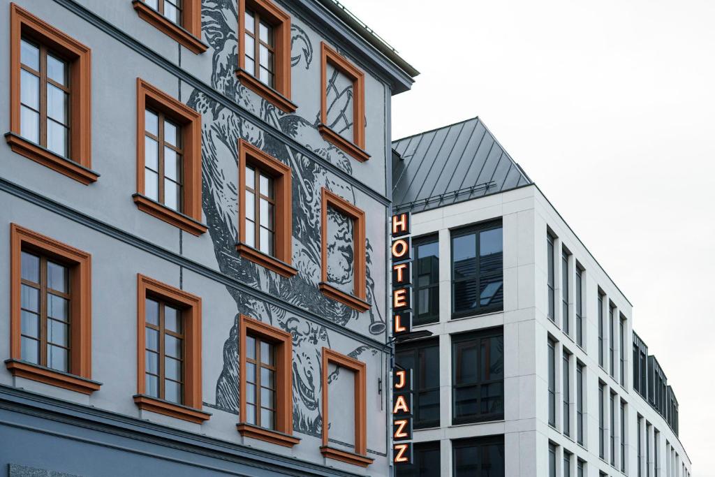 a building with a sign on the side of it at Hotel Jazz Market Square Wroclaw in Wrocław