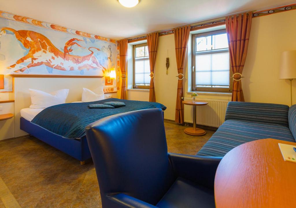 Postel nebo postele na pokoji v ubytování Hotel & Ferienwohnungen Bohlenblick
