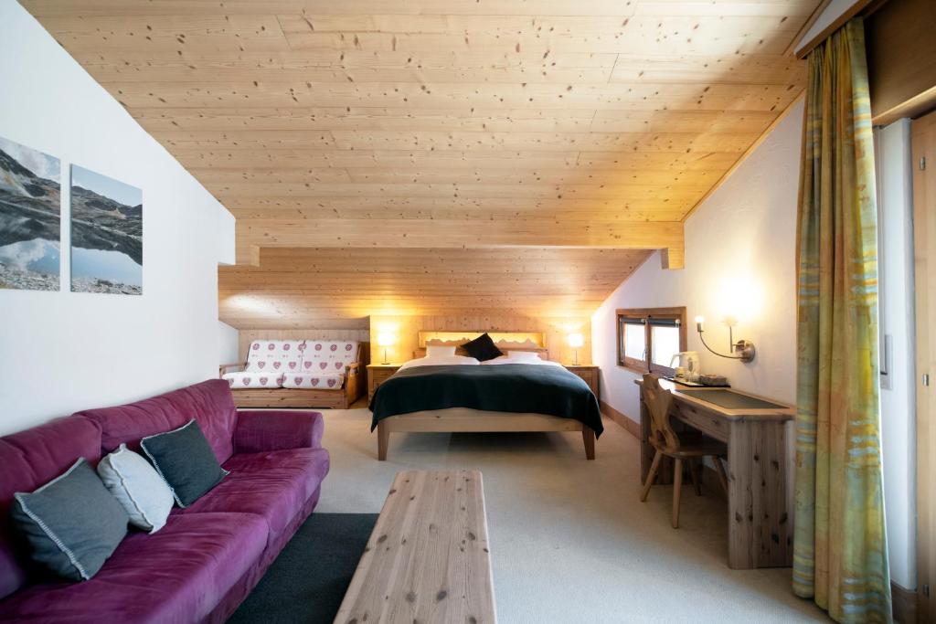 Postel nebo postele na pokoji v ubytování Hotel le Beausite