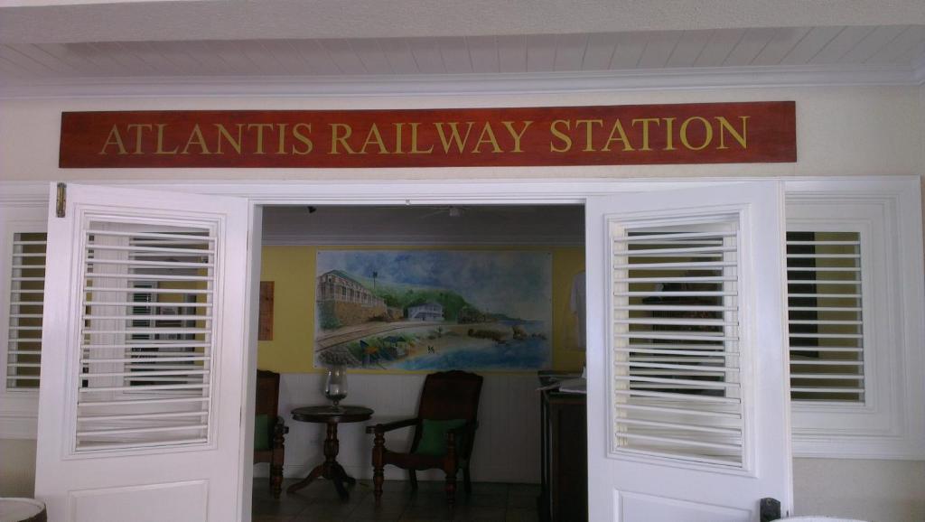 a sign over the entrance to an atantis rail way station at The Atlantis Historic Inn in Saint Joseph