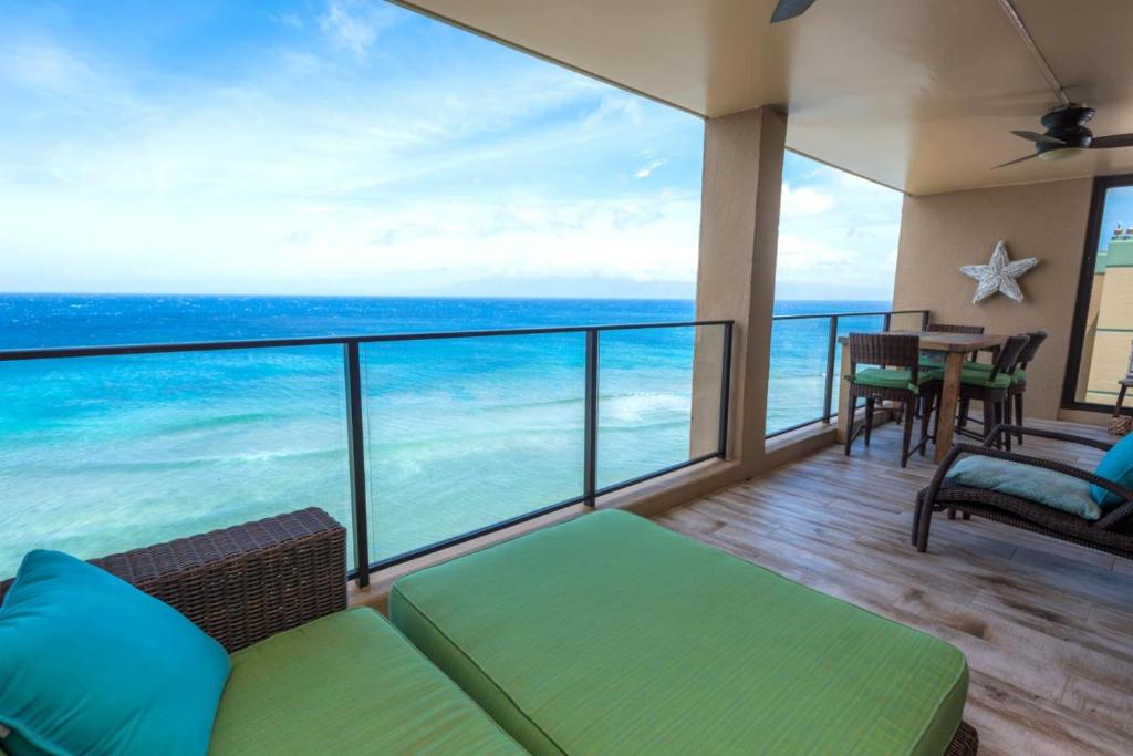 a balcony with a view of the ocean at K B M Resorts- MAH-1211 Penthouse 2Bd, ocean views as far as you can see, remodeled in Kaanapali