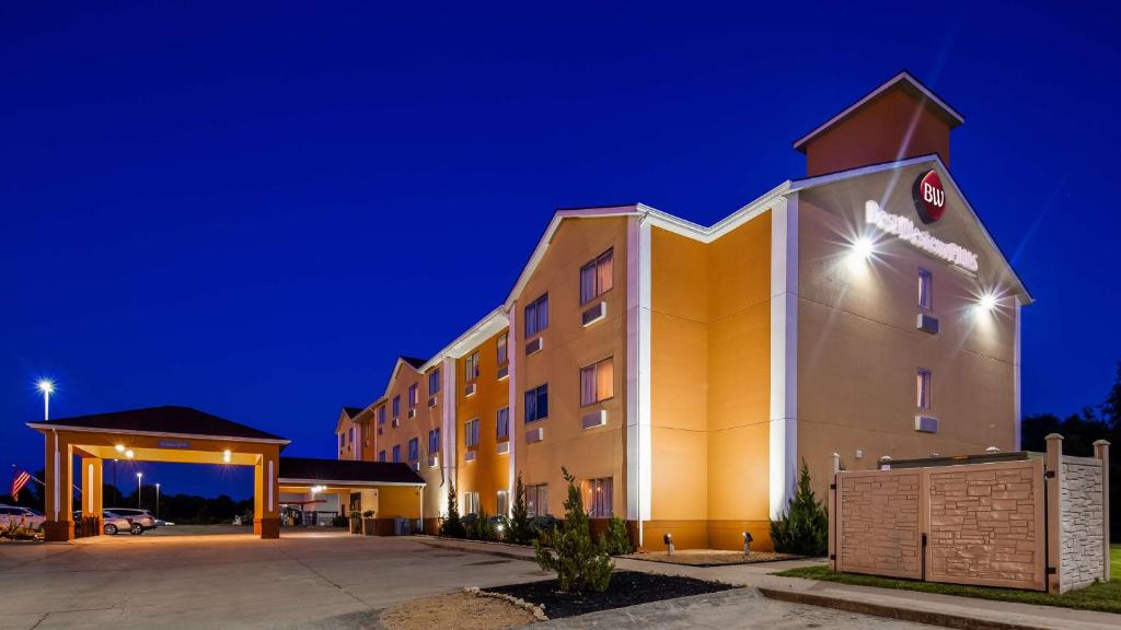 a hotel building at night with a parking lot at Best Western Plus Whitewater Inn in Harrison