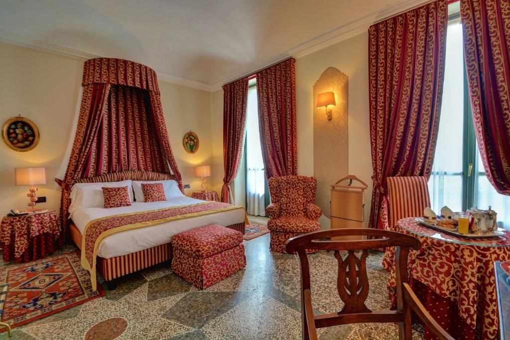 Postel nebo postele na pokoji v ubytování Best Western Hotel Genio