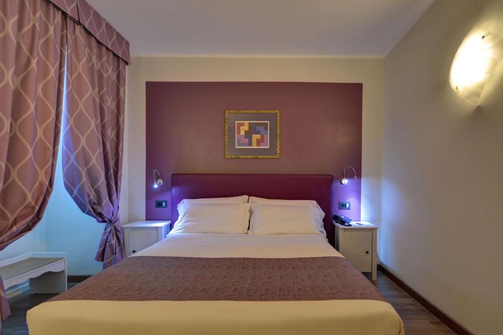 Postel nebo postele na pokoji v ubytování Best Western Hotel Genio