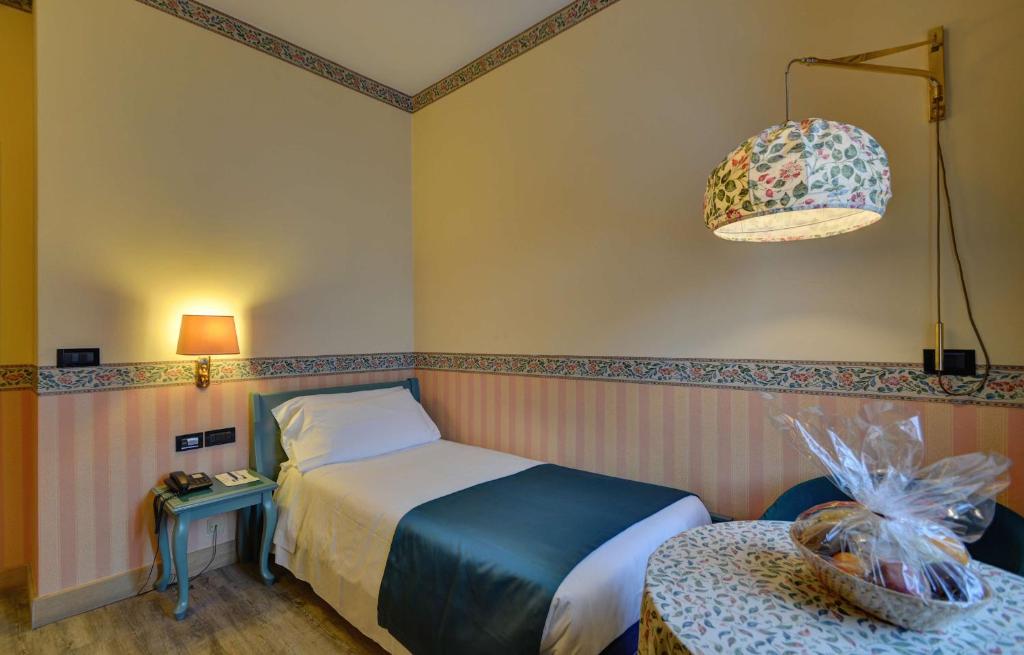 Postel nebo postele na pokoji v ubytování Best Western Hotel Genio