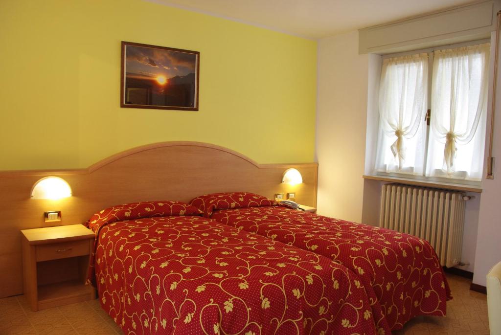 Postel nebo postele na pokoji v ubytování Hotel Residence Panoramica