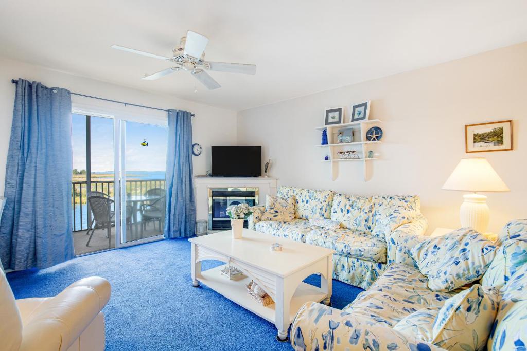 a living room with a couch and a table at Bethany Bay Condos in Ocean View