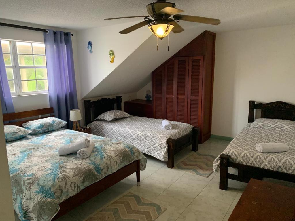Cama ou camas em um quarto em Villa Sunny Days