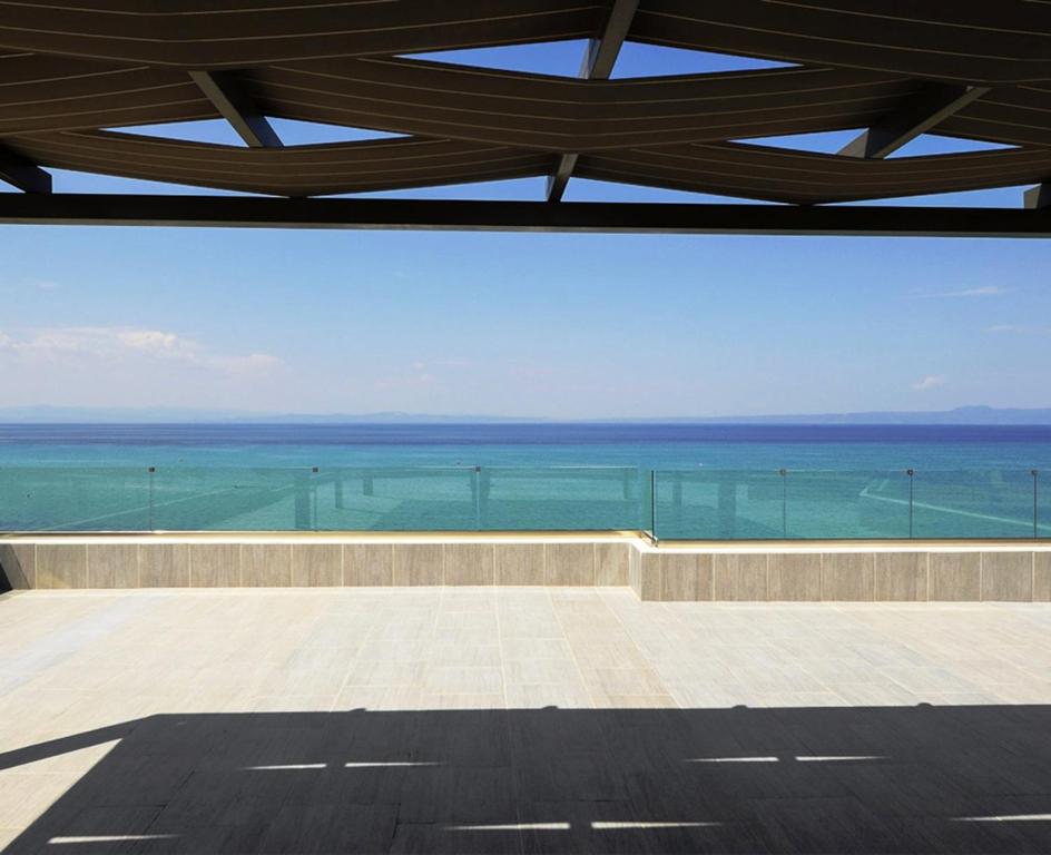 a view of the ocean from the roof of a building at Ostria Sea Side Hotel in Hanioti