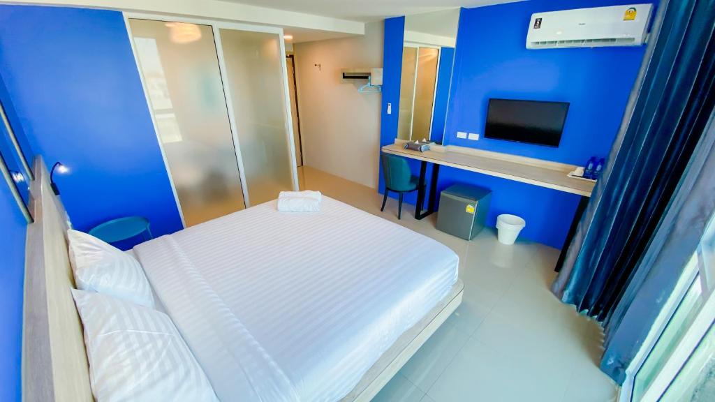 Postel nebo postele na pokoji v ubytování วัน บัดเจท เชียงราย สนามกีฬา One Budget Hotel Chiangrai Stadium