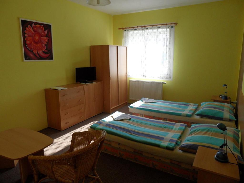 Postel nebo postele na pokoji v ubytování Penzion Skalíček