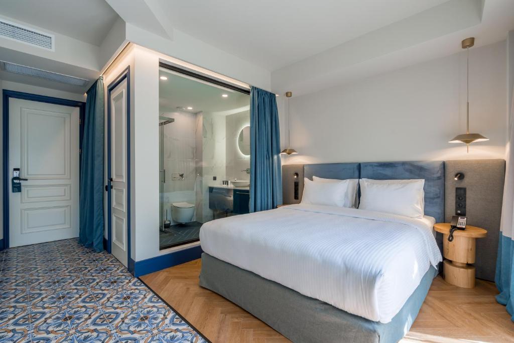 Postel nebo postele na pokoji v ubytování Abanotubani Boutique hotel