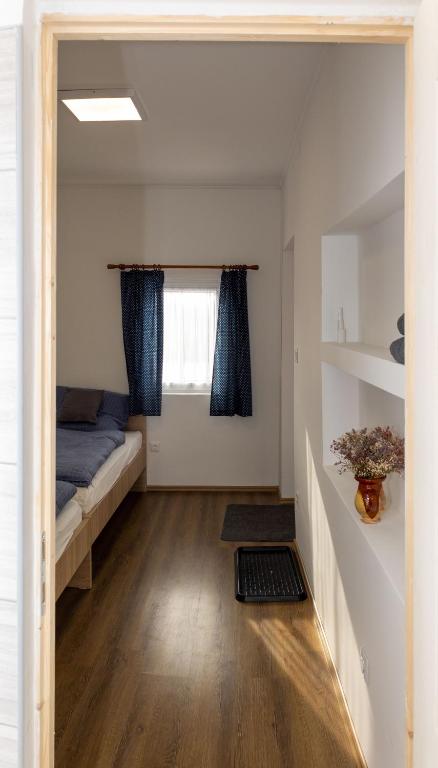 Postel nebo postele na pokoji v ubytování Takács Pince apartman