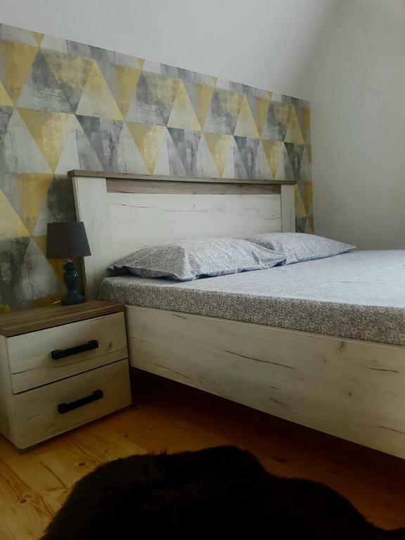 Postel nebo postele na pokoji v ubytování Šumske priče Divčibare