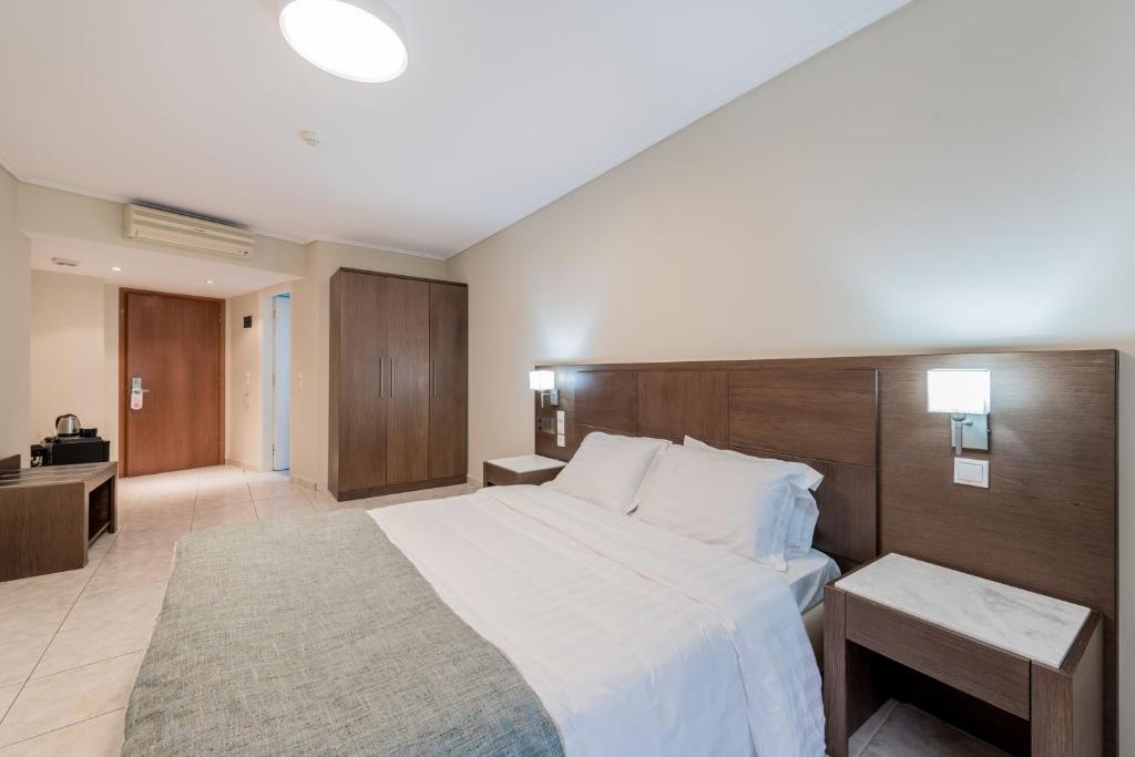Postel nebo postele na pokoji v ubytování Katerina Palace Hotel