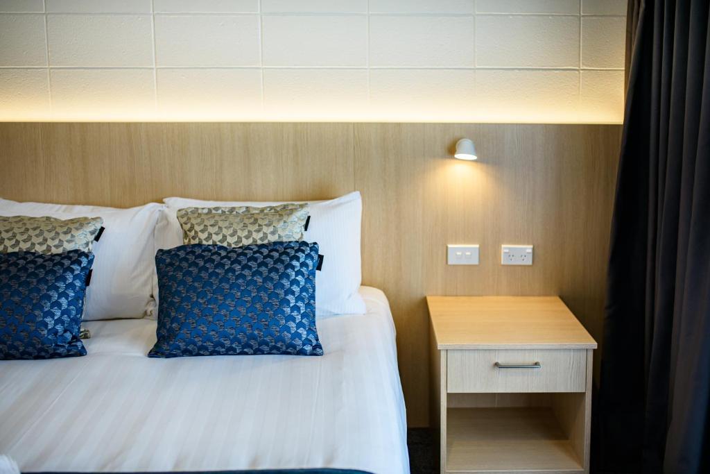 Postel nebo postele na pokoji v ubytování Takapuna International Motor Lodge