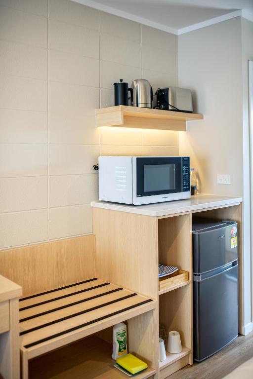 Kuchyň nebo kuchyňský kout v ubytování Takapuna International Motor Lodge