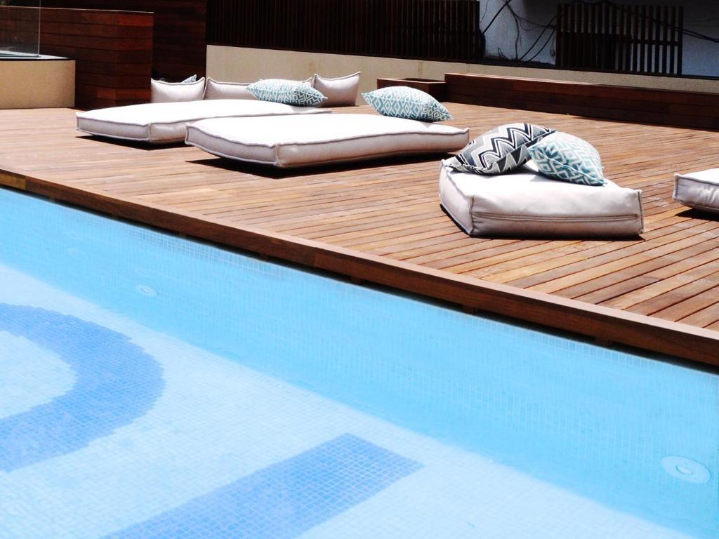 a swimming pool with four pillows on top of it at TOC Hostel Barcelona in Barcelona