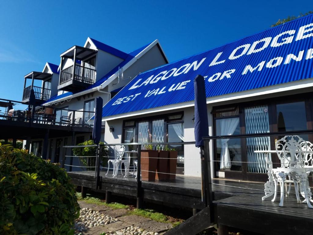 
a blue and white building with a train on top of it at Lagoon Lodge in Knysna
