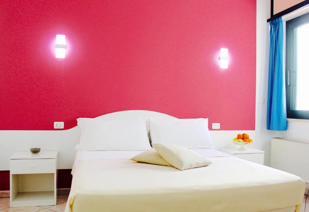 Postel nebo postele na pokoji v ubytování Hotel Baia del Cigno