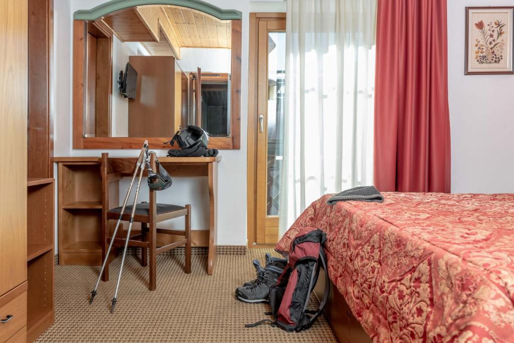 Postel nebo postele na pokoji v ubytování Hotel Italo