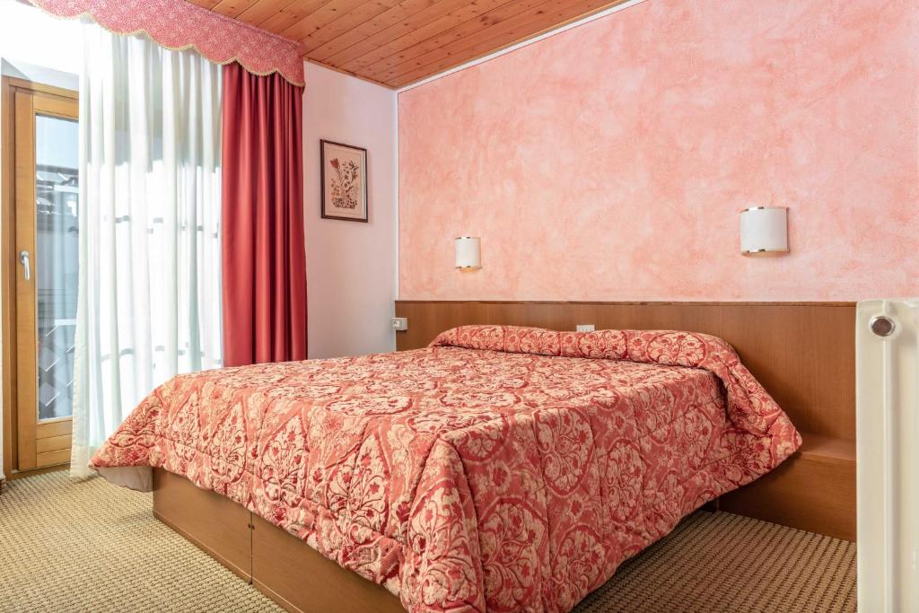 Postel nebo postele na pokoji v ubytování Hotel Italo