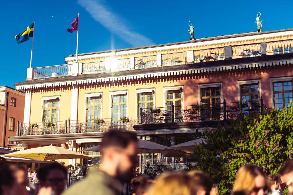 a group of people standing in front of a building at Hotel Hasselbacken in Stockholm
