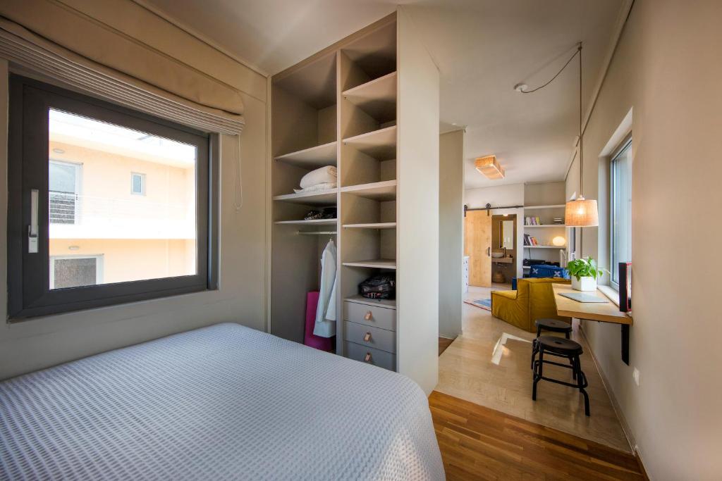 Posteľ alebo postele v izbe v ubytovaní Sunny Loft with Acropolis View