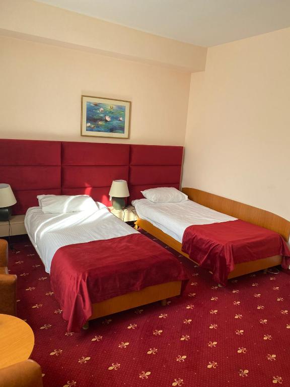 Postel nebo postele na pokoji v ubytování Hotel Class