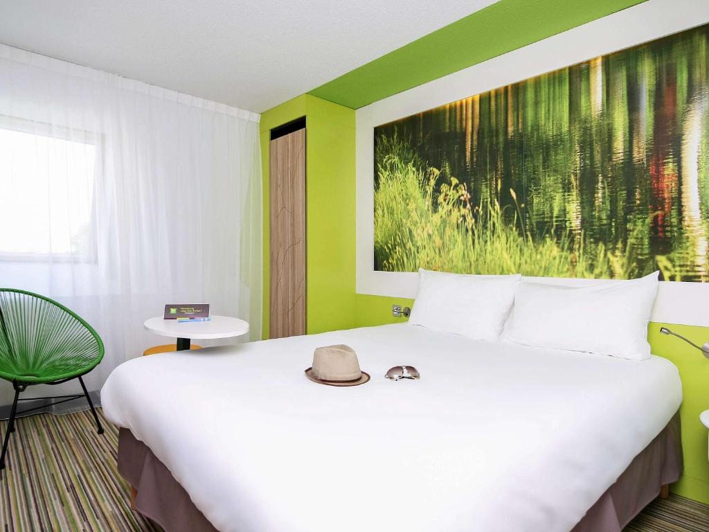 Postel nebo postele na pokoji v ubytování Ibis Styles Toulouse Labège