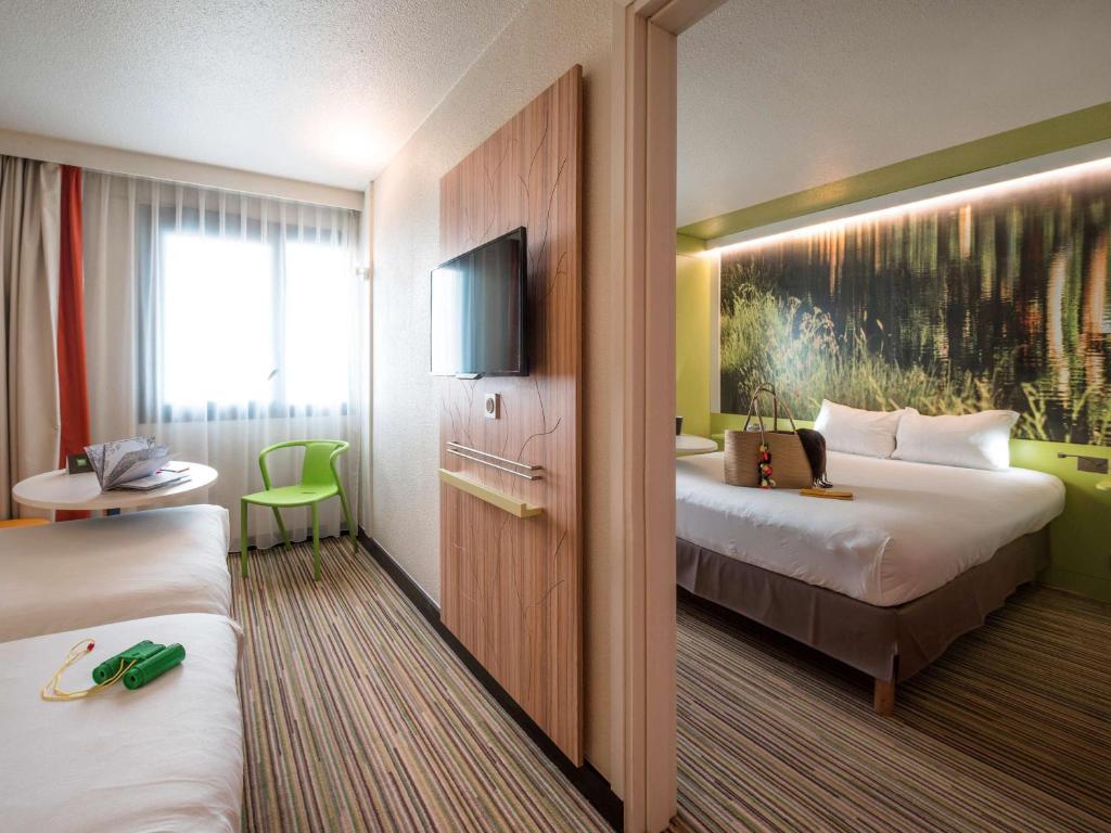 Postel nebo postele na pokoji v ubytování Ibis Styles Toulouse Labège