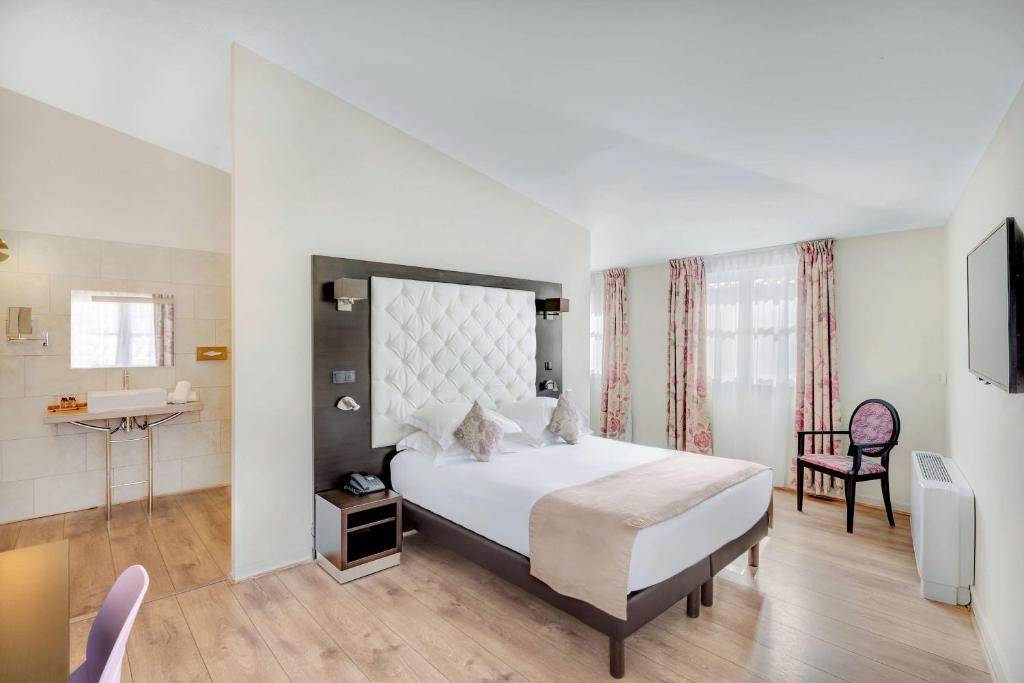 Postel nebo postele na pokoji v ubytování Best Western Marquis de la Baume