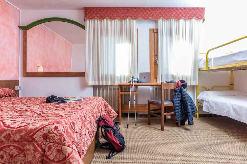 Postel nebo postele na pokoji v ubytování Hotel Italo
