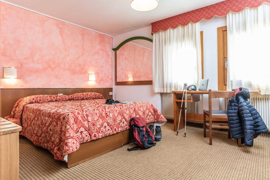 Postel nebo postele na pokoji v ubytování Hotel Italo