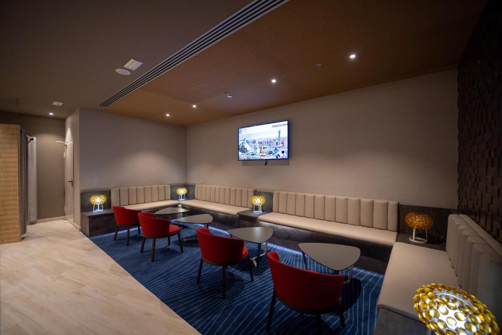 A seating area at abba Sevilla