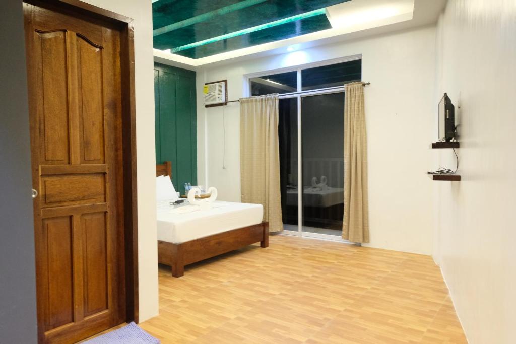 Postel nebo postele na pokoji v ubytování MANANQUIL TRAVEL LODGE