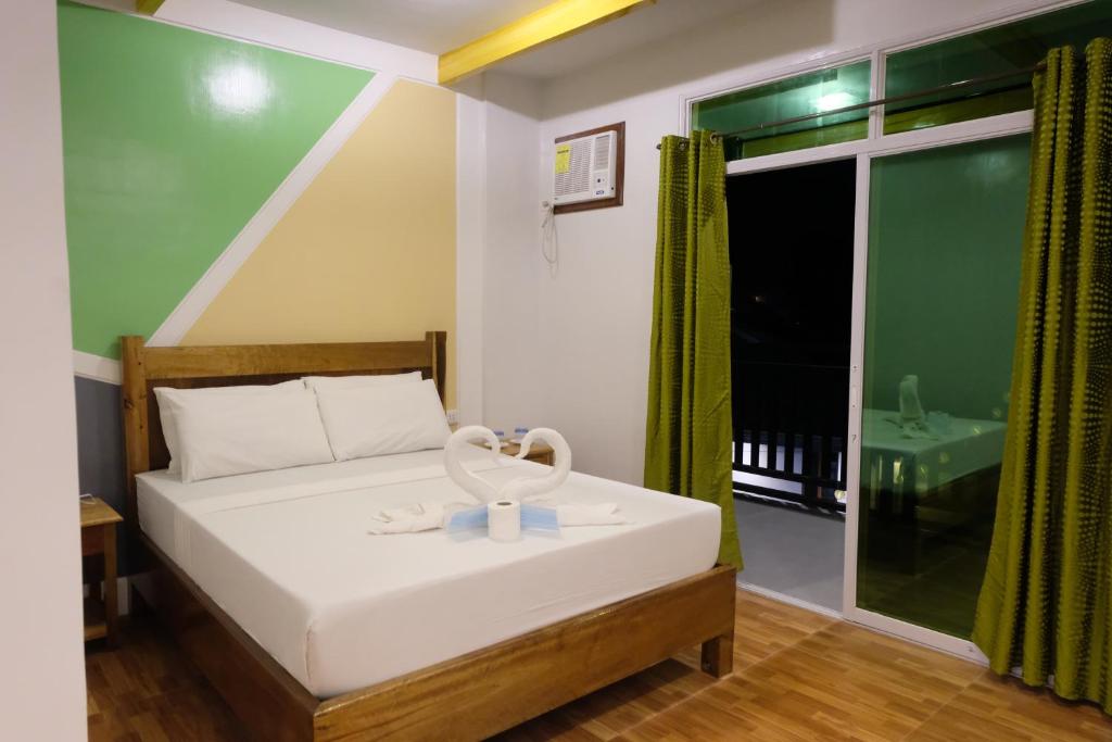 Postel nebo postele na pokoji v ubytování MANANQUIL TRAVEL LODGE