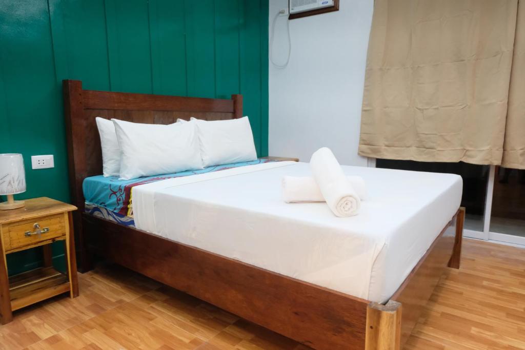 Postel nebo postele na pokoji v ubytování MANANQUIL TRAVEL LODGE