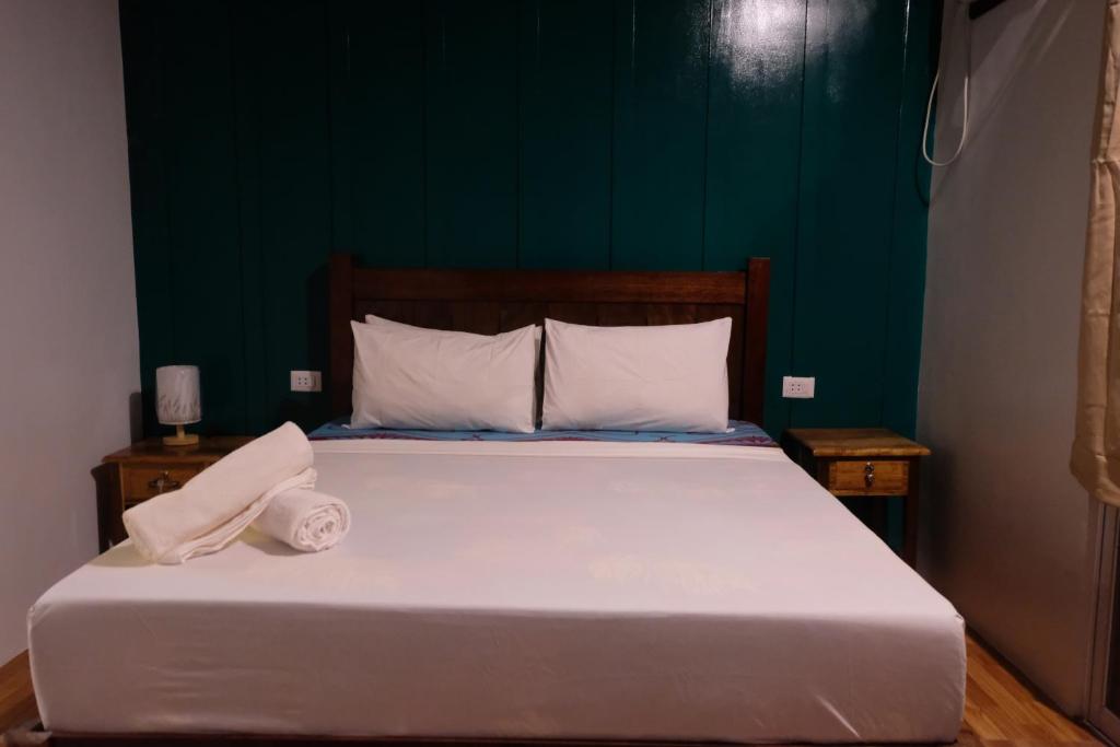 Postel nebo postele na pokoji v ubytování MANANQUIL TRAVEL LODGE