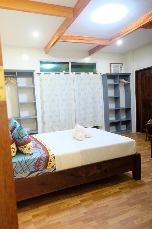 Postel nebo postele na pokoji v ubytování MANANQUIL TRAVEL LODGE