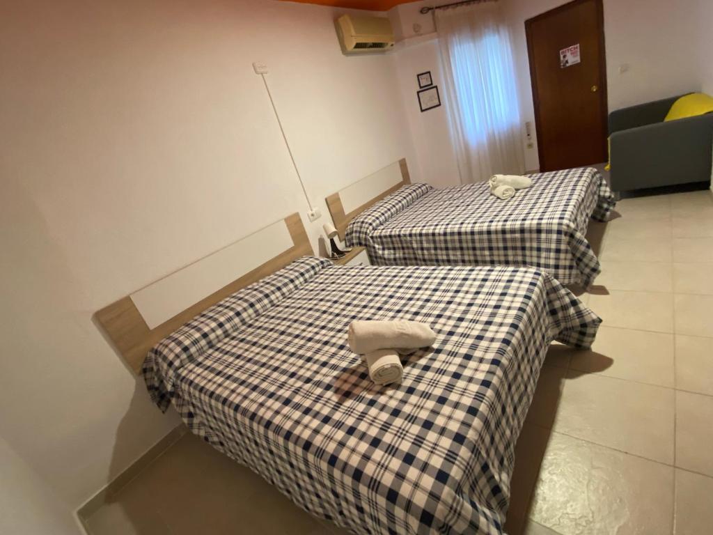 Postel nebo postele na pokoji v ubytování Arc House Ribera Only Adults