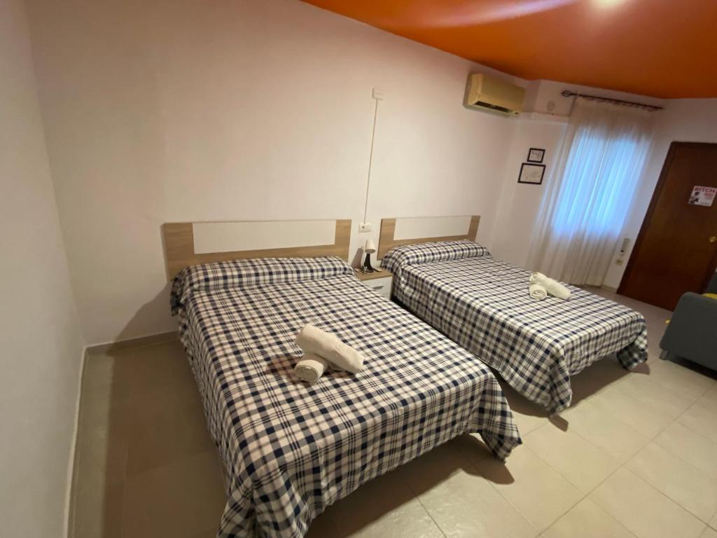 Postel nebo postele na pokoji v ubytování Arc House Ribera Only Adults
